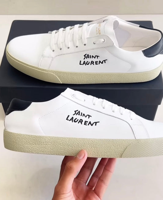 White shoes with brand logo in black